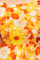 Saga klänning Dag Orange | blommig festklänning