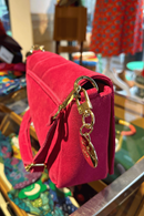 Shoulder strap bag in hot pink suede