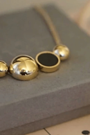 Solar golden necklace - round shapes in steel