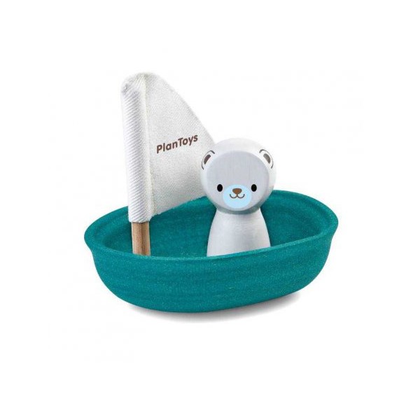 Segelbåt i trä med isbjörn